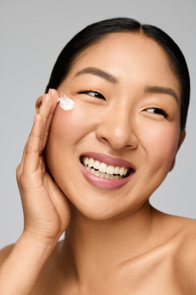 petite model posing for skincare shoot