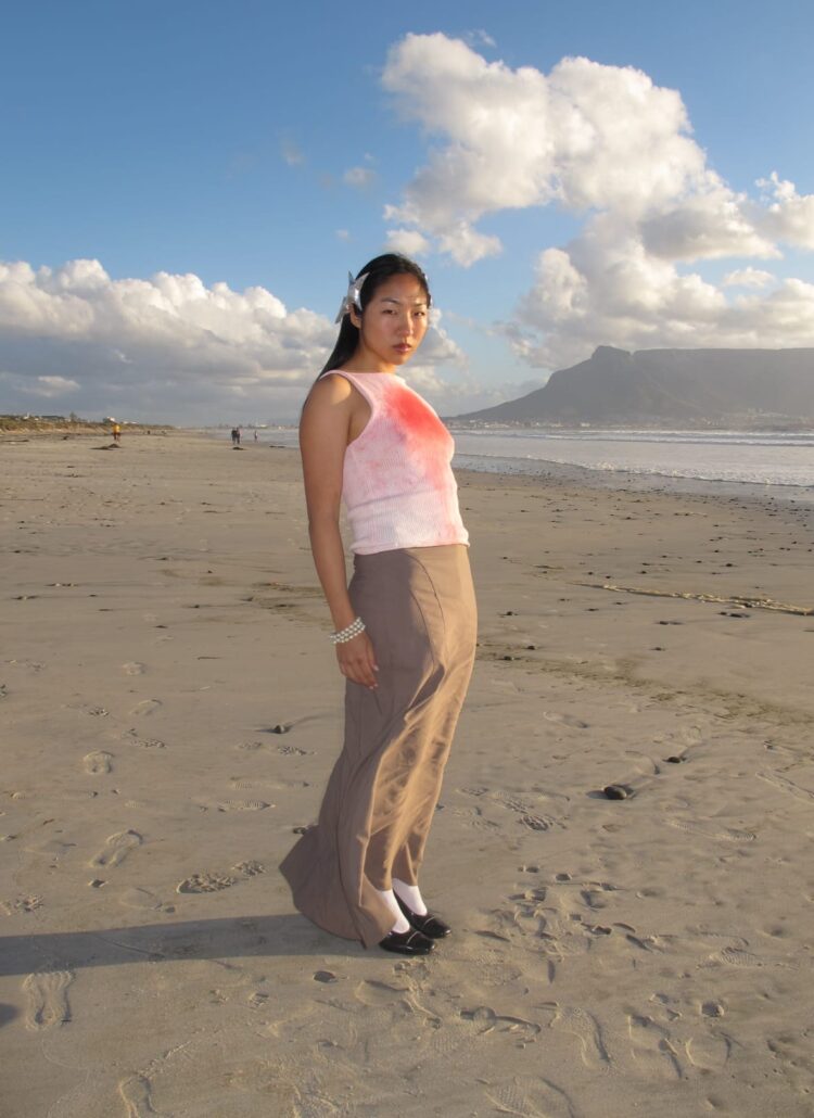 Model poses at beach